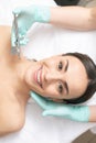Confident woman smiling at the oxygen spray treatment