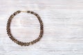 Top view of faceted smoky quartz necklace on gray Royalty Free Stock Photo