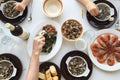 Top view of family eating seafood around a white table from high view angle