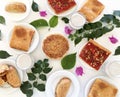 Top view of family eating Spanish Tapas around a white table from high view angle Royalty Free Stock Photo