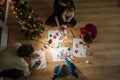Family of five making holiday decorations