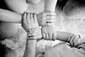 Top view of family hands holding each others wrists in circle Royalty Free Stock Photo