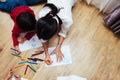 Top view Family happy children group kid boy and girl kindergarten paint drawing on peper with teacher education together Royalty Free Stock Photo