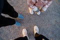 Top view of family legs on the ground outdoors. Bonding time together. Simple things