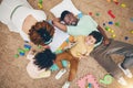 Top view, family and parents with children on floor with toys, number puzzle and bonding at home. Happy, educational Royalty Free Stock Photo