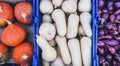 Top view of Farmers Market stall selling organic vegetables. Japanese Hokkaido pumpkins, butternut squash, purple onions