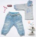 Top view fashion trendy look of baby boy clothes with toy Royalty Free Stock Photo