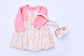 Top view fashion trendy look of baby girl clothes and toy stuff. Baby fashion concept Royalty Free Stock Photo