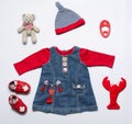 Top view fashion trendy look of baby girl clothes and toy stuff