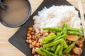 Fast food duck meat with pork and peanuts and beans with rice and porridge horizontal composition Royalty Free Stock Photo