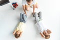 top view of father helping sons in doing abs Royalty Free Stock Photo