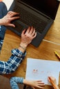 Top view of Father working in his home office on a laptop, her daughter sits next to her and draw, Man freelance