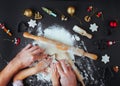 Top view of fathers and kids hands making Christmas cookies on b Royalty Free Stock Photo