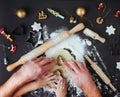 Top view of fathers and kids hands making Christmas cookies on b Royalty Free Stock Photo