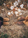 Top view of feet of young couple on cotton field