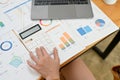 Top view, A female accountant or financial worker working at her office desk, using calculator and analysing financial tax data on Royalty Free Stock Photo