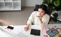 Top view of female designer working in graphic design using computer Sit and choose colors and work intently in your Royalty Free Stock Photo