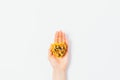 Top view of female hand with handful of walnuts