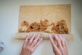 Top view of female hand rolling a delicious apple strudel