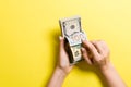 Top view of female hands counting money. One hundred and other dollar banknotes on colorful background. Business concept Royalty Free Stock Photo