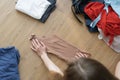 top view of female hands fold clothes. The process of sorting things. Royalty Free Stock Photo