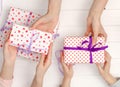 Top view of female hands holding gifts for different occasions Royalty Free Stock Photo
