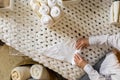 Top view female hands neatly folded white clean towels in case box use Marie Kondo organizing method Royalty Free Stock Photo