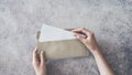 Top view of female hands opening envelope Royalty Free Stock Photo