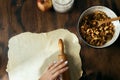 Top view female hands roll out dough preparation apple strudel Royalty Free Stock Photo