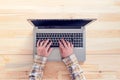 Top view of female hands typing on laptop computer keyboard Royalty Free Stock Photo