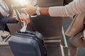 Female passenger weighing luggage at airport check in Royalty Free Stock Photo