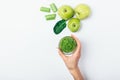 Top view female's hand holding glass of green smoothie Royalty Free Stock Photo