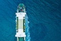 Top view on the ferry boat for car transportation on the blue water of the Adriatic sea. Automobiles on the deck. Royalty Free Stock Photo