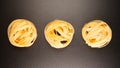 TOP VIEW: Fettuccine pastas nests on a black table