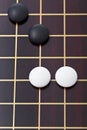 Top view of few stones during go game playing