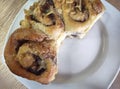 Top view of fiadoe rum-and-raisin rolls on white plate Royalty Free Stock Photo