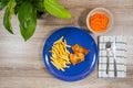 Top view of fish and chips and a bowl carrot salad as a side Royalty Free Stock Photo