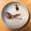 Top view of the fish leftovers on the plate
