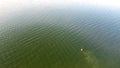 Top view fisherman wade fishing with waterproof jacket wader at Lavon Lake, Texas, USA