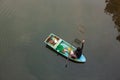 Top view, fishermen with traditional crab trap sitting on boat in the river of mangrove forest. beautiful reflection. Trat,