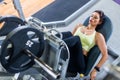 Top view of a fit young woman doing leg press in the gym Royalty Free Stock Photo