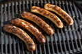 Top view from five grilled sausage on a grill