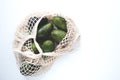 Top view of flat composition, avocado on light background. Royalty Free Stock Photo