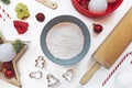 Top view flat lay with Christmas cookie cutters, bowl with flour, rolling pin and egg for baking cookies Royalty Free Stock Photo