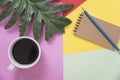 Top view flat lay of coffee cup with pencil, notebook, leaves