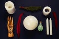 Flat lay esoteric still life with candles,feather, potion, juniper ,crystal ball and wooden hand Royalty Free Stock Photo