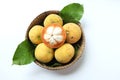 Fresh sliced santol Sandoricum koetjape fruit in a Wicker basket.the famous fruit Thailand and seasonal fruit