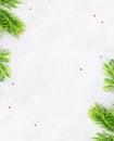 Top view flat lay natural Christmas tree branches corner frame on bright background. New year decor concept Royalty Free Stock Photo