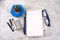 notebook with blank white sheet , pen, money,credit cards, glasses and succulent Royalty Free Stock Photo