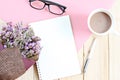 Top view or flat lay of open notebook paper, bouquet of dried wild flowers and coffee cup on desk table Royalty Free Stock Photo